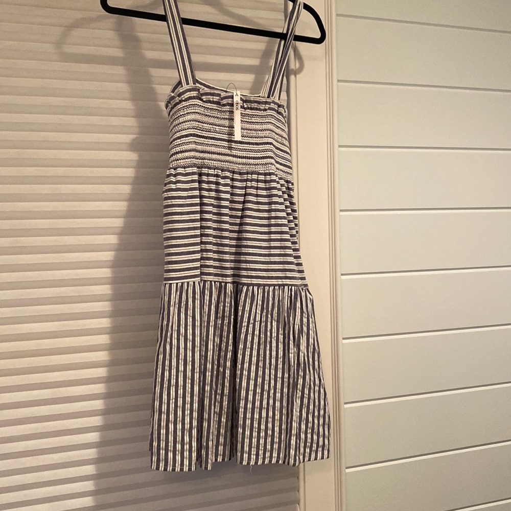 Slate Blue and white stripped dress never worn size 4 slight rip on side